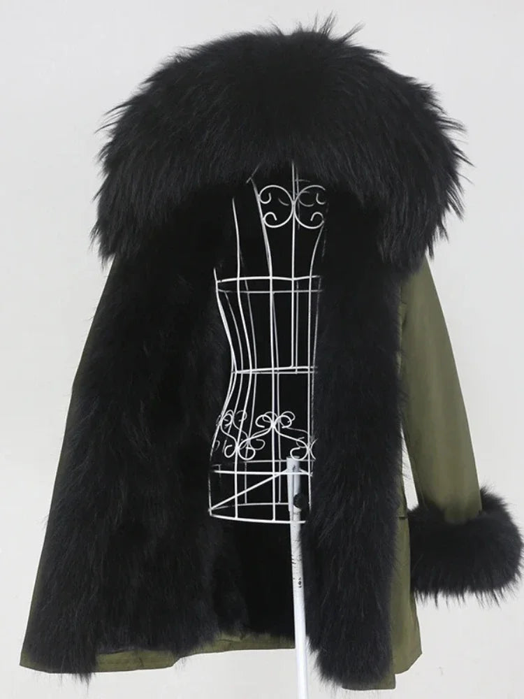 Green coat with black fur trim on a white background