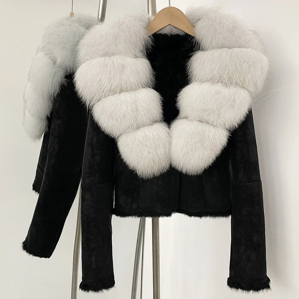 Black leather jacket with white fur collar on a hanger against a white background