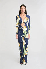 Full view of a model wearing a floral print off-shoulder maxi dress