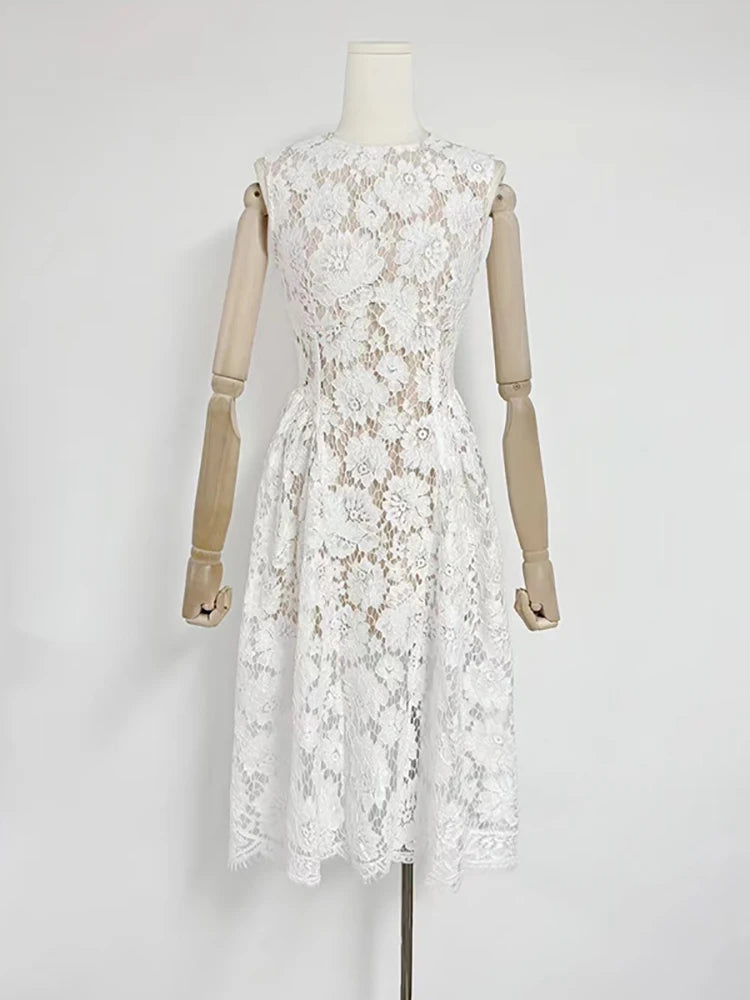 White lace dress on a mannequin against a white background