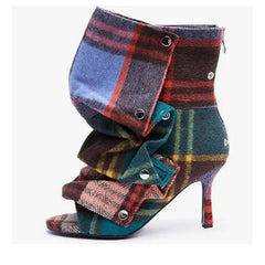 Peep toe stiletto heel boots in multicolored plaid fabric.