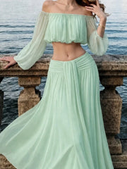 Mint green off-shoulder chiffon crop top and maxi skirt with ruched waist detail.