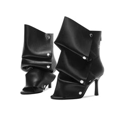 Peep toe stiletto heel boots in black faux leather.