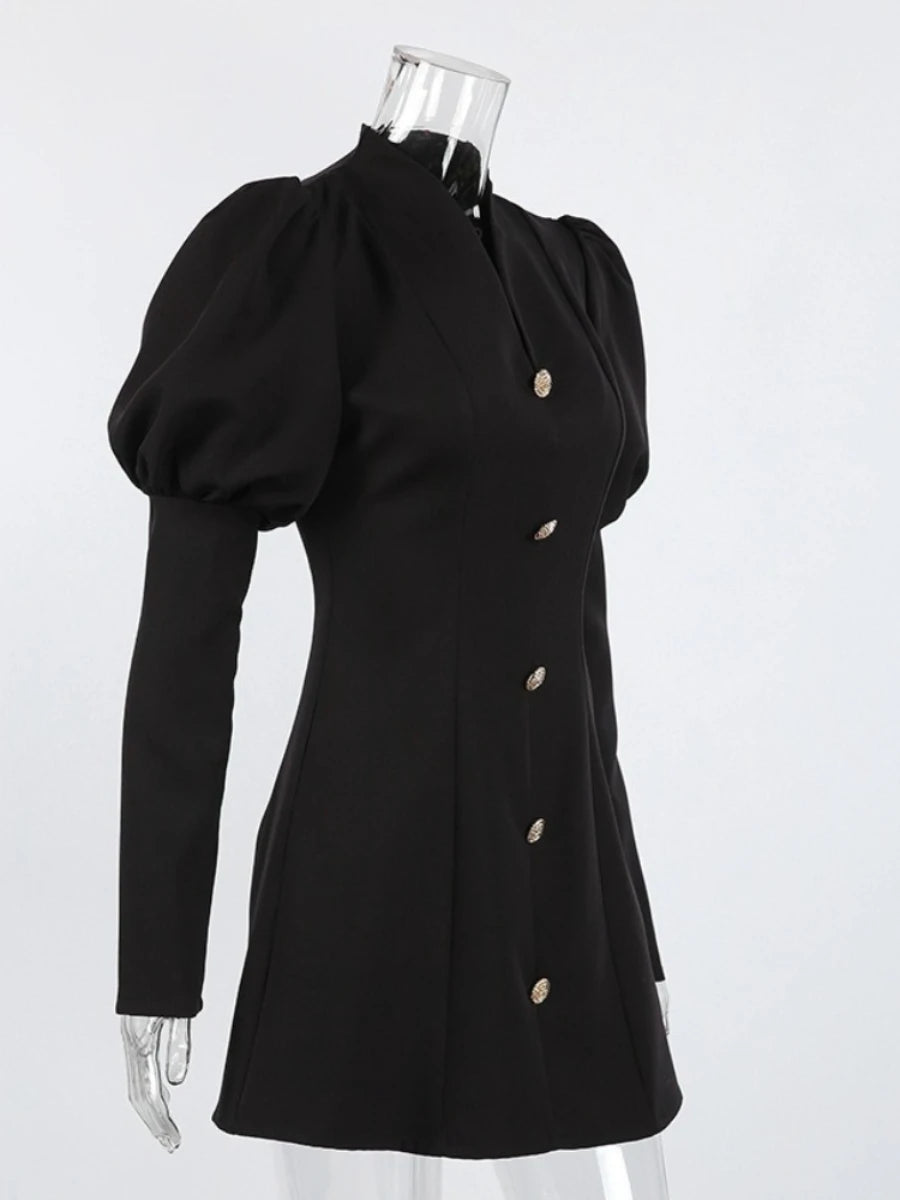 Black dress with puffed sleeves on a mannequin against a white background