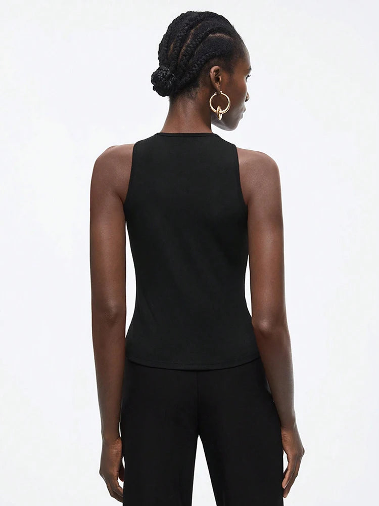 Person wearing a black sleeveless top and pants 