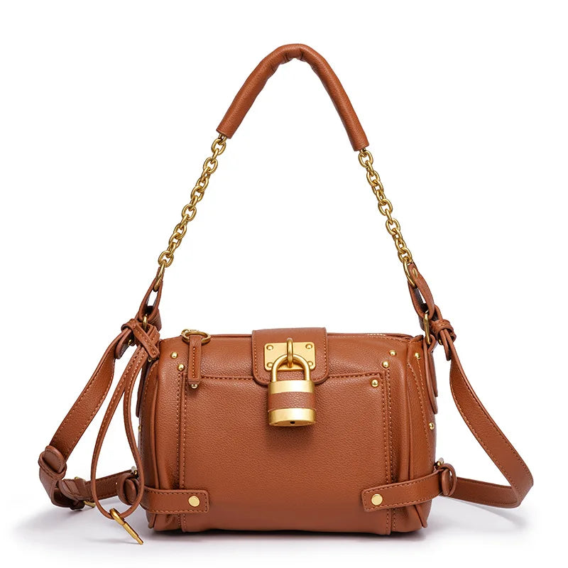 Tan structured leather bag with gold lock detail and chain strap