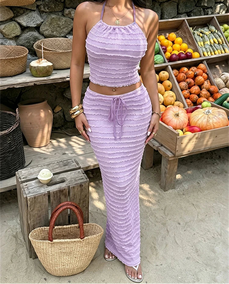 Textured knit halter crop top and column skirt set in purple.