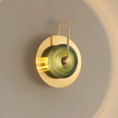 A close-up of the Golden Atelier Modern Wall Sconce, highlighting its unique design and luxurious materials. B