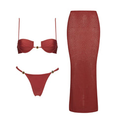 Red monochrome two-piece bikini set with textured knit skirt.
