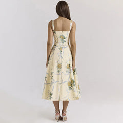 Woman wearing a floral dress on a plain background