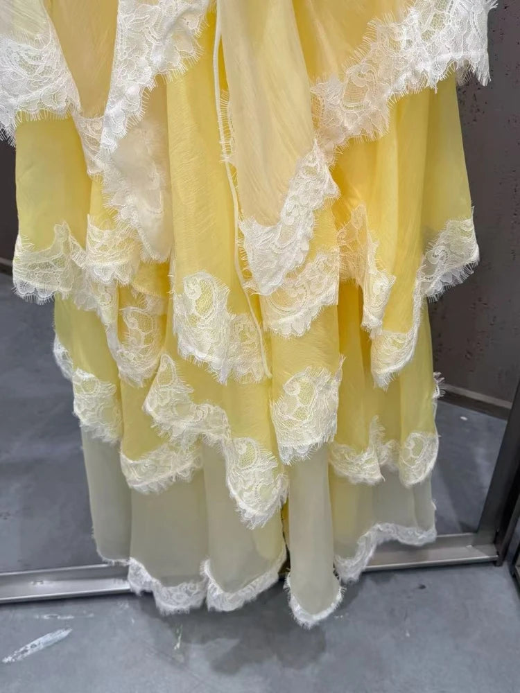 Yellow lace dress on a gray background