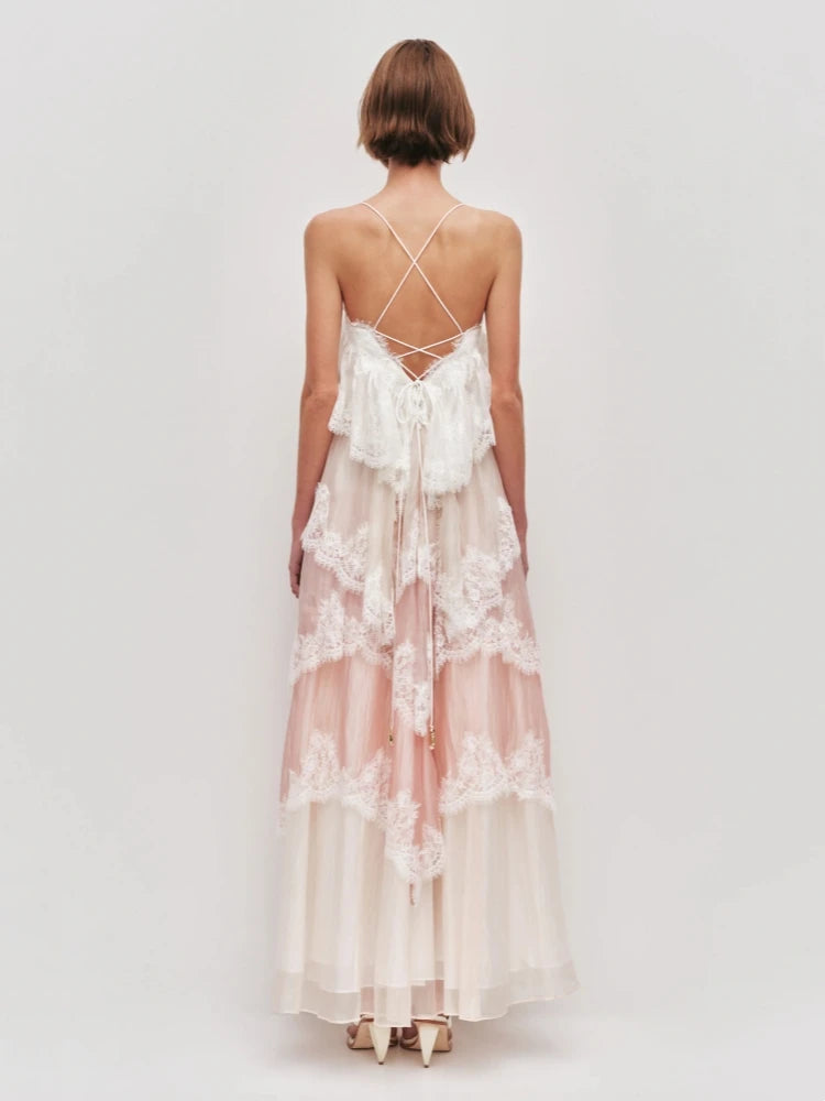 Woman wearing a lace dress with a white background