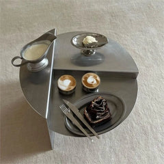 Elegant round stainless steel coffee table with a minimalist wabi-sabi design. Golden Atelier 1