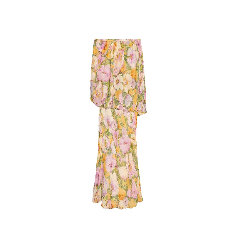 Floral dress with pink, yellow, and green colors on a white background