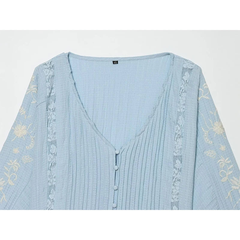 Detail of Embroidered V-Neck Pleated Blouse neckline