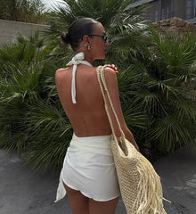 Back view of textured one-piece swimsuit and wrap skirt