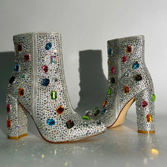 Pair of rhinestone embellished pointed toe ankle boots with block heels