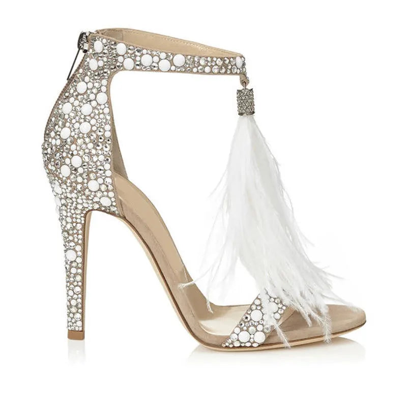 Side view of feather embellished stiletto heels showcasing the delicate feather fringe.