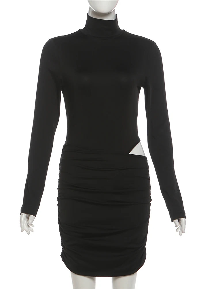 Black dress with long sleeves on a mannequin against a white background