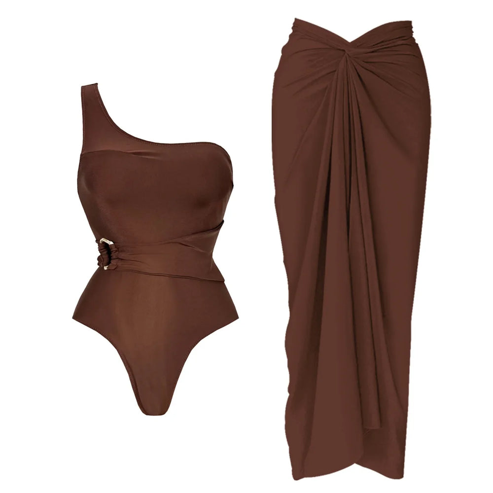 Brown one shoulder swimsuit with a matching long skirt