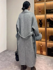 Women's winter lace-up fur lapel overcoat with long sleeves.