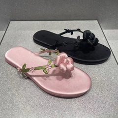 Pink floral embellished flip-flops