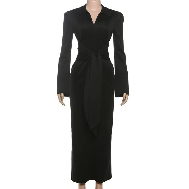 Black dress on a mannequin against a white background