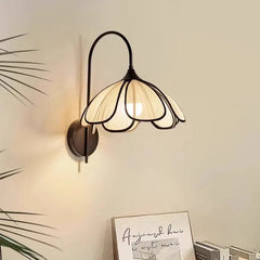 Hand-knitted abaca lotus flower wall lamp with black iron frame and cream shade in zen bedroom