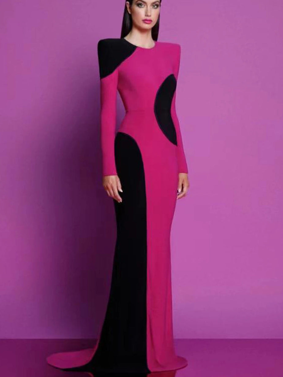 Woman wearing a pink and black dress against a purple background 