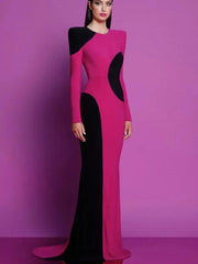 Woman wearing a pink and black dress against a purple background 