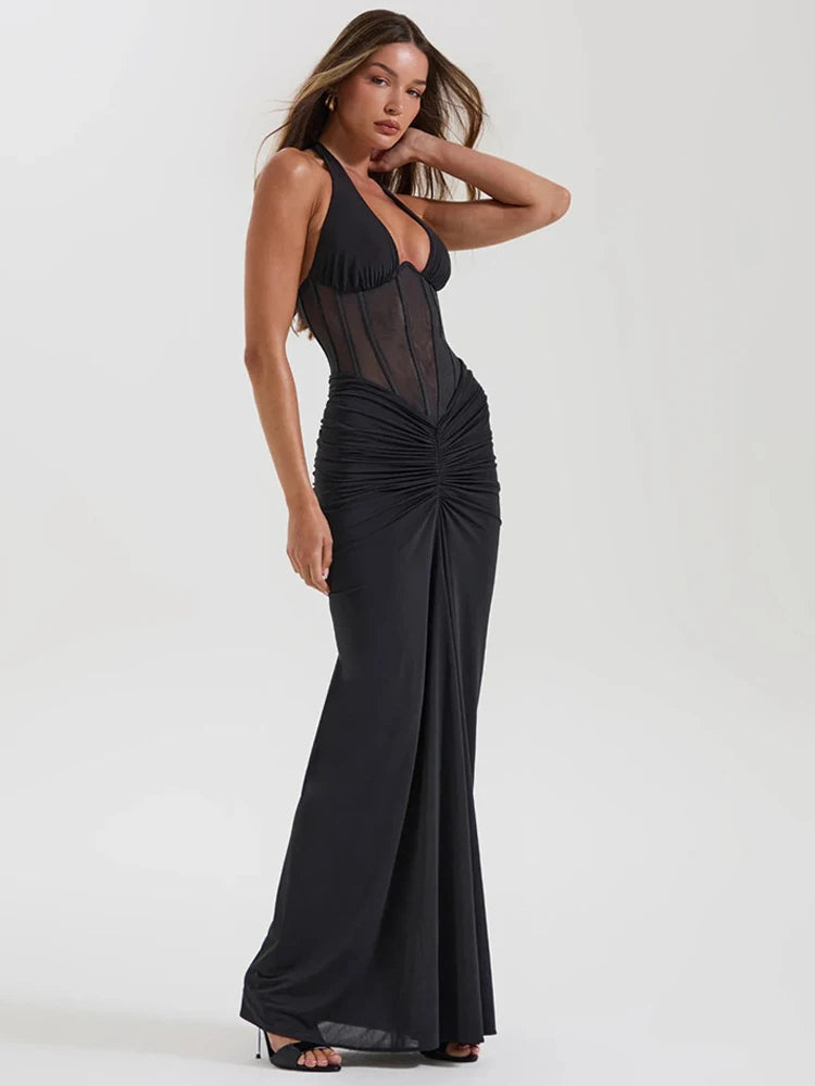 Black halter neck maxi dress with sheer bodice and ruched skirt