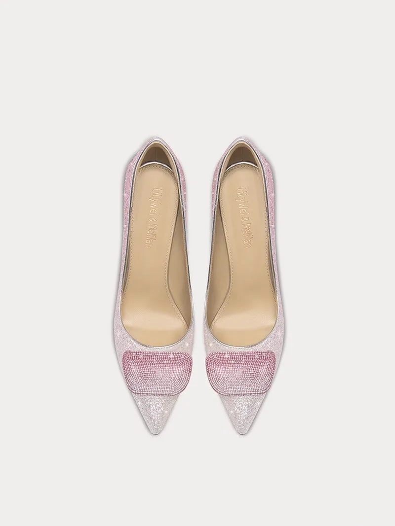 Pair of glittery pink high-heeled shoes on a light gray background