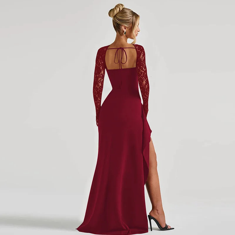 Red evening gown with lace detailing on a plain background