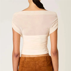Back view of sheer ruched mesh off-shoulder crop top in cream