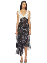 Contrast panel polka dot maxi dress with asymmetrical hem.