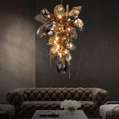 Luxury chandelier hanging above a sofa in a dimly lit room