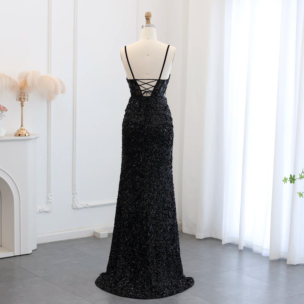 Black sequin evening gown on a mannequin against a white curtain background