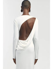White long-sleeve dress with open back on a white background