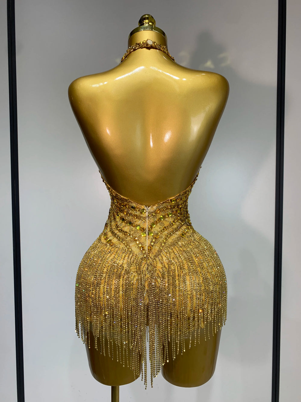 Gold rhinestone halter bodysuit detail