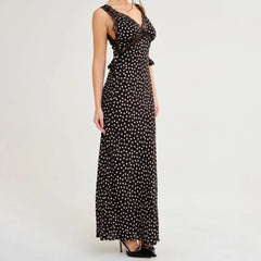 Black and white polka dot dress on a white background