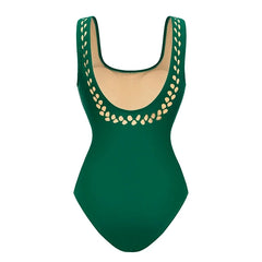 Back view of green cut-out embellished one-piece swimsuit.