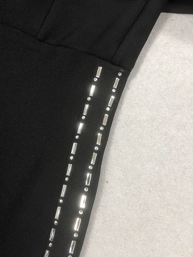 Black leggings with reflective silver accents on a light gray background