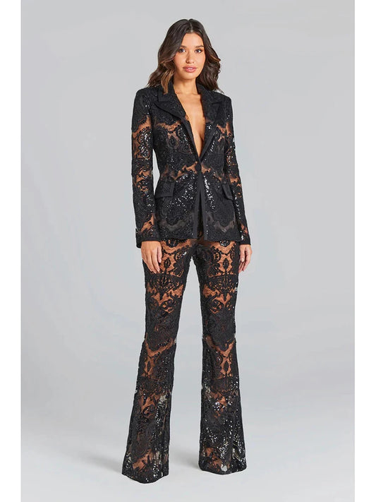 Black sequin embroidered lace blazer and flare pants set worn by a model.