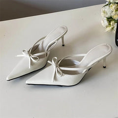 Butterfly-knot pointed toe low heels sandals for women.