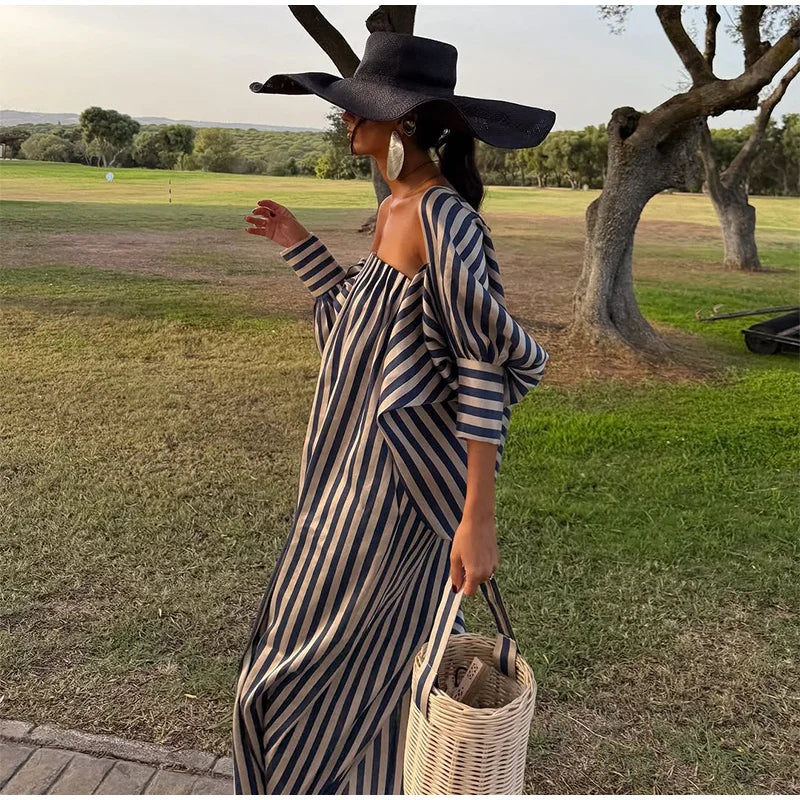 Side view of strapless stripe maxi dress
