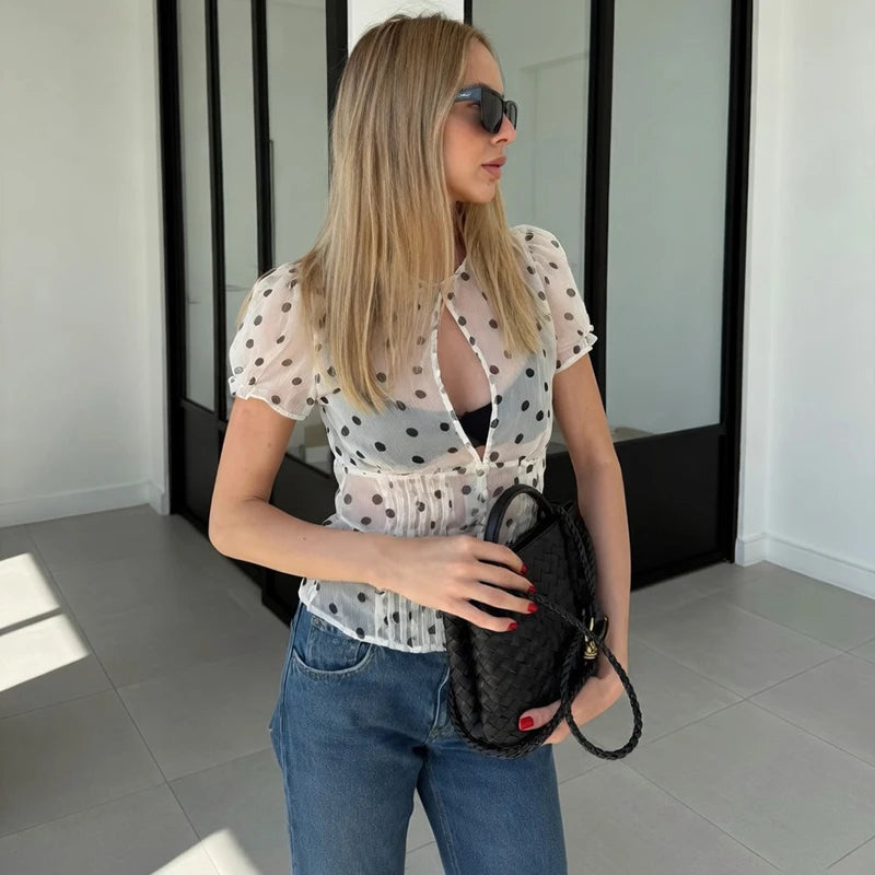 Sheer polka dot puff sleeve blouse from side profile
