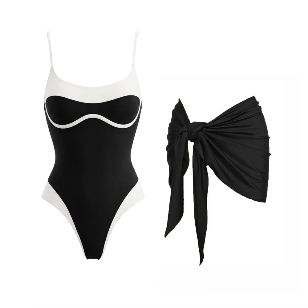 Black and white contrast trim one-piece swimsuit with a tied black sarong accessory