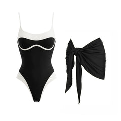 Black and white contrast trim one-piece swimsuit with a tied black sarong accessory