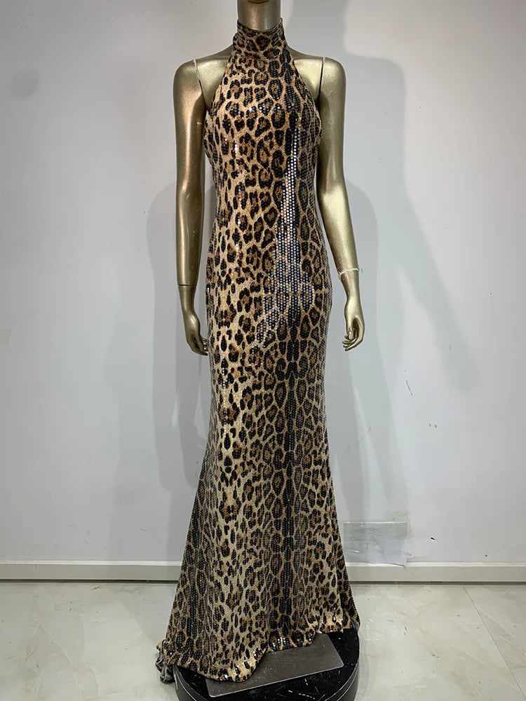Leopard print evening gown on a mannequin against a white background