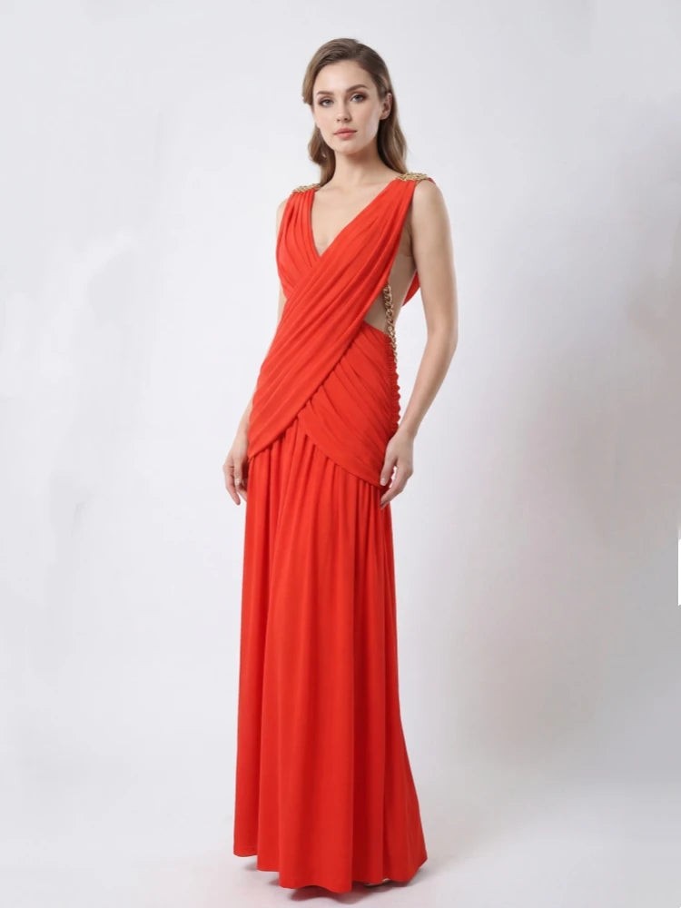 Woman wearing a red evening gown on a white background